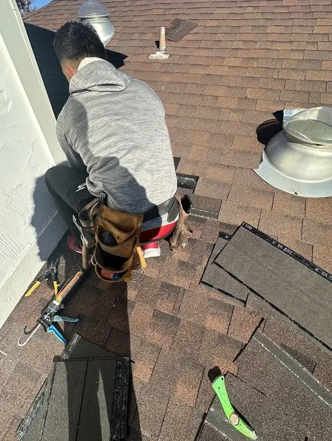 Metal Roof Installation crew at work on a residential roof in Clanton